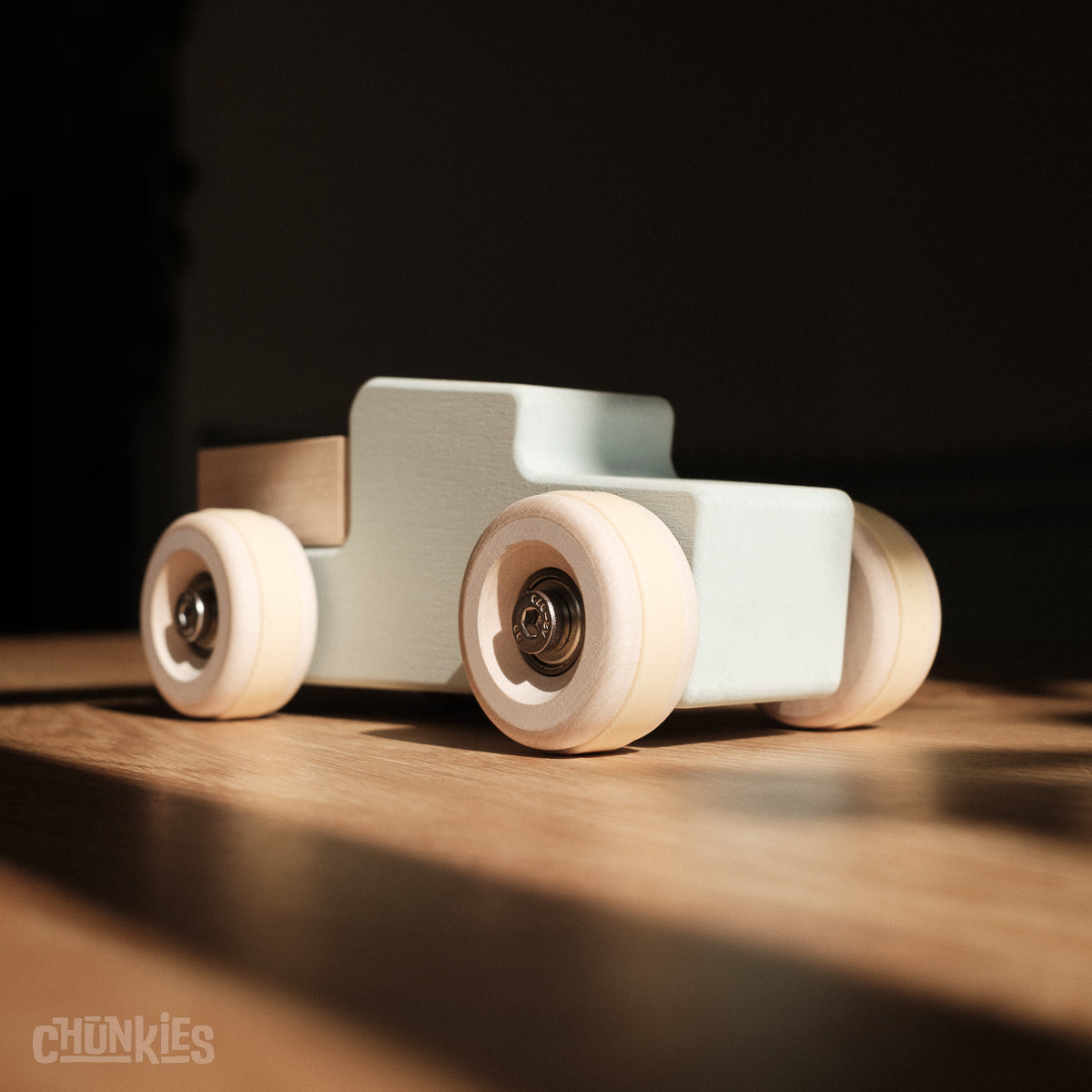 Chunkies: Light blue wooden toy car in the shape of a vintage pick-up truck with wooden wheels, skate bearings and stainless steel hardware. Built to last generations. 