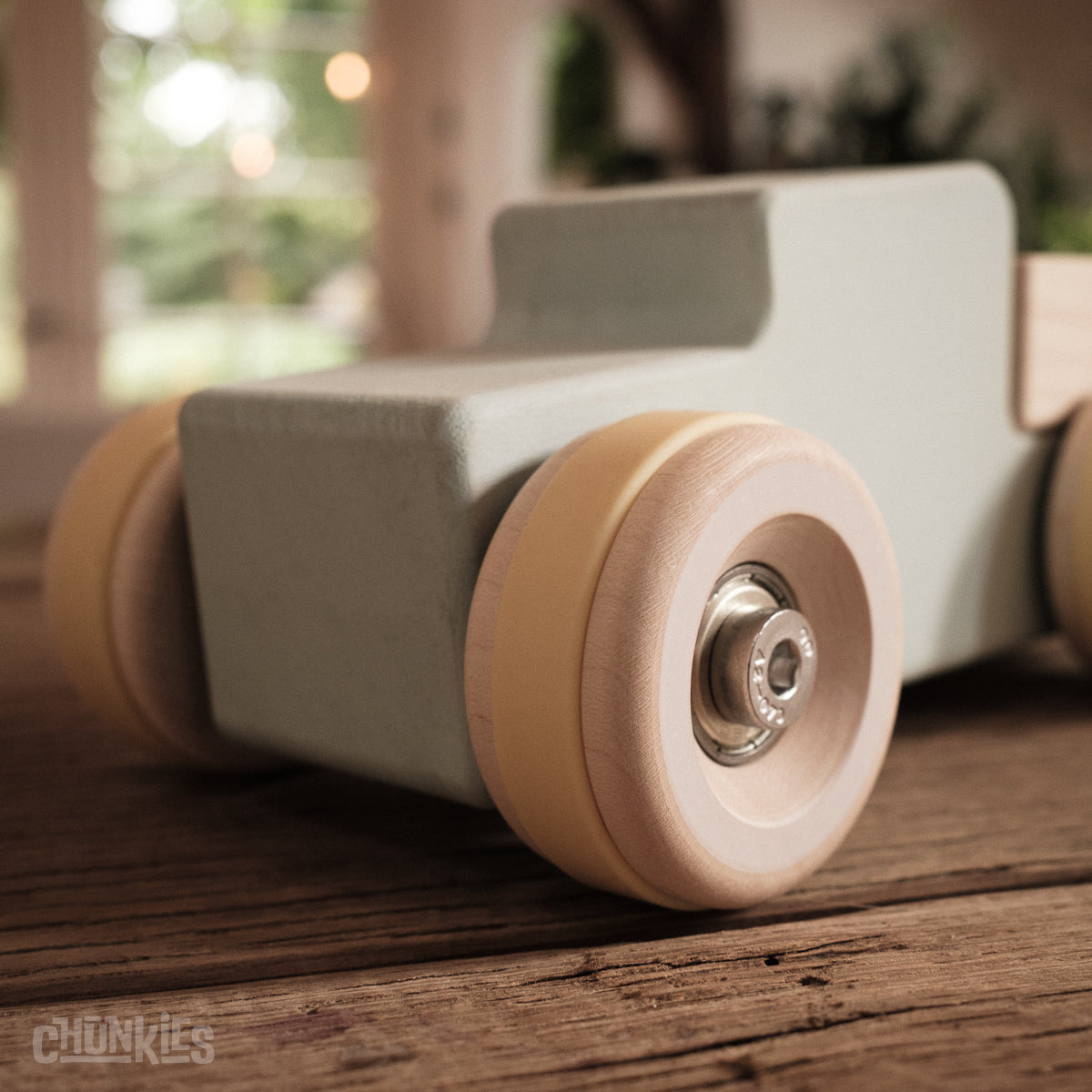 Chunkies: Light blue wooden toy car in the shape of a vintage pick-up truck with wooden wheels, skate bearings and stainless steel hardware. Built to last generations. 